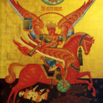 Iconic Orthodox-style painting: crowned rider on a red winged horse slays a dragon against a gold background with scattered buildings below.