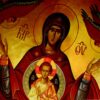 Icon of the Virgin Mary with Christ, halos and blessing gesture, flanked by red-winged angels on a gold backdrop